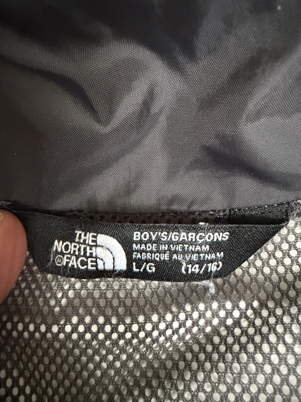 (172)The North Face Kids' Two-Tone Gray & Black Raincoat with Red Accents